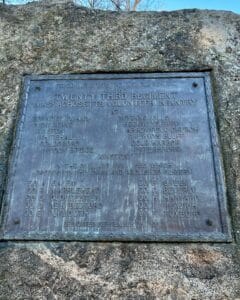 A metal plaque embedded in a stone in Salem, Massachusetts, commemorating the faithful service of the 23rd Massachusetts Volunteer Infantry during the Civil War.
