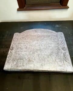 A historic gravestone replica of Sarah How, wife of Colonel Thomas How, dated April 9th, 1724, on display in Salem Massachusetts.