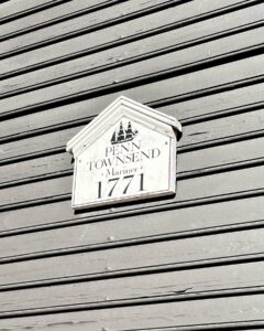 Plaque reading "Penn Townsend Mariner 1771" on the exterior of a historic house in Salem Massachusetts