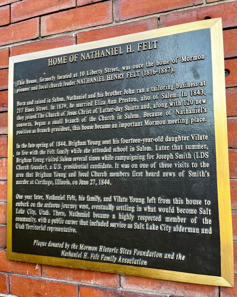 A historic plaque on a brick wall in Salem, Massachusetts, detailing the life and contributions of Nathaniel H. Felt, a Mormon pioneer and community leader.