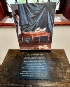 Image of a painting and an informational plaque about the Pickman House in Salem, Massachusetts, detailing its historical significance and ties to the Peabody Essex Museum.