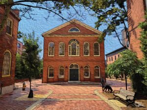 Old Town Hall in Salem, Massachusetts, featuring its classic red-brick exterior, tall arched windows, and charming brick plaza.