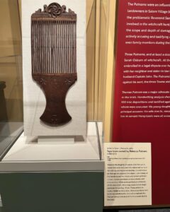 A finely decorated tape loom from salem massachusetts with carved hearts, crosses, and other protective designs that date back to the late 1600s or early 1700s.