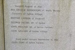 Stone memorial engraving in Salem honoring Rev. George Burroughs, Martha Carrier, George Jacobs Sr., John Procter Sr., John Willard, and Giles Cory, who died during the Salem witch trials of 1692.