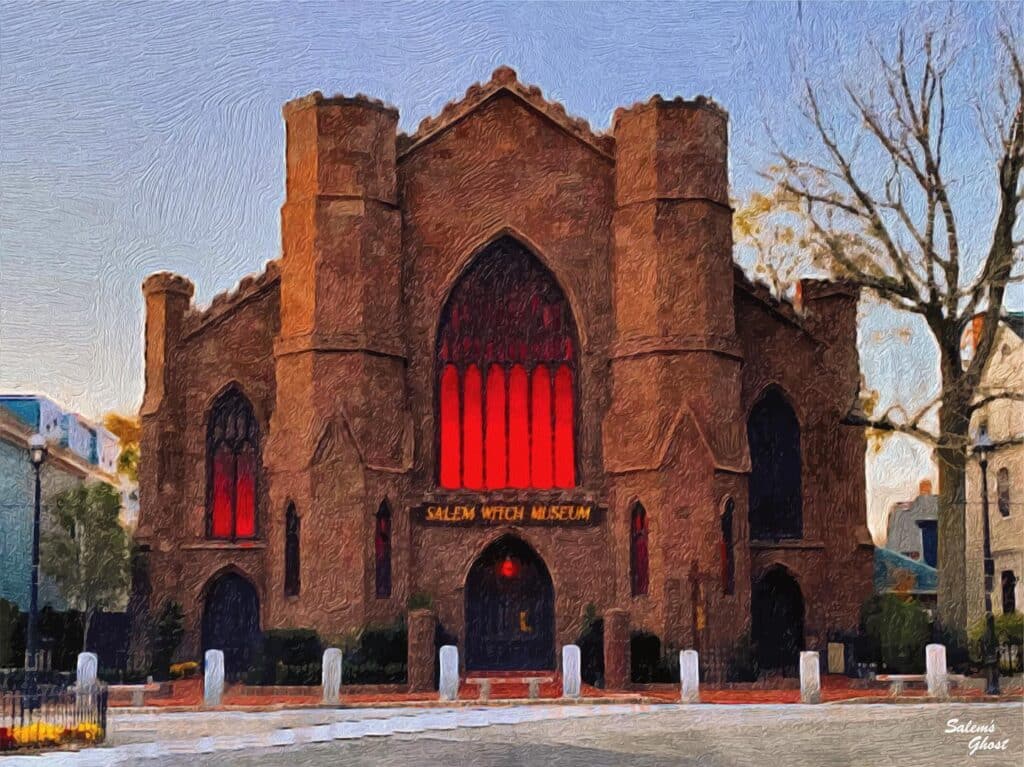 Salem Witch Museum in Salem, Massachusetts, with its striking Gothic architecture and glowing red windows at twilight.