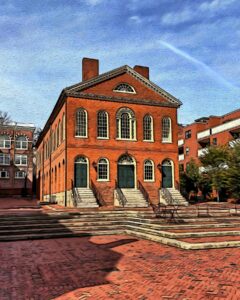 A colorful artistic rendering of the Old Town Hall in Salem, Massachusetts, showcasing its red brick façade, arched windows, and green doors, set amidst a quaint brick plaza.